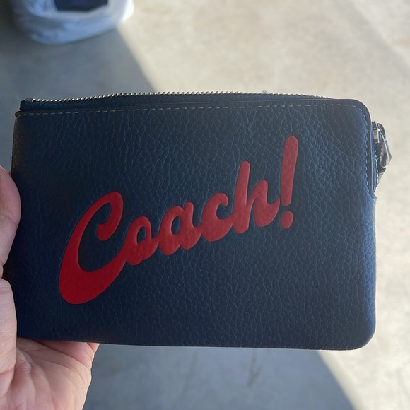 Coach Handbags - Coach Blue Wristlet with Red Accent